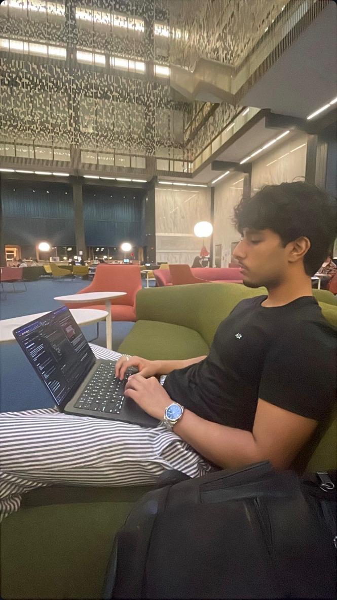 Ismaeel Akram in a library setting.