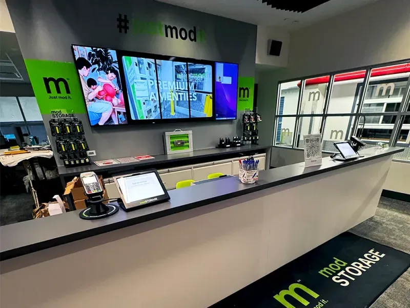 Climate-controlled hallway with secure storage units and LED lighting